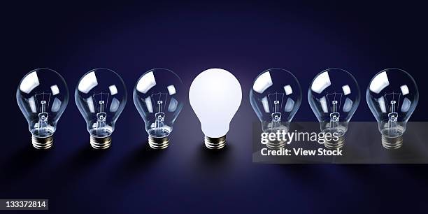 light bulb,concept - lightbulbs in a row stock pictures, royalty-free photos & images