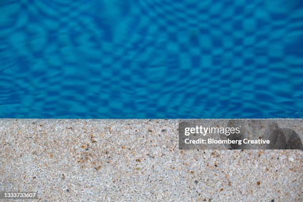 swimming pool edge - hair part stock pictures, royalty-free photos & images