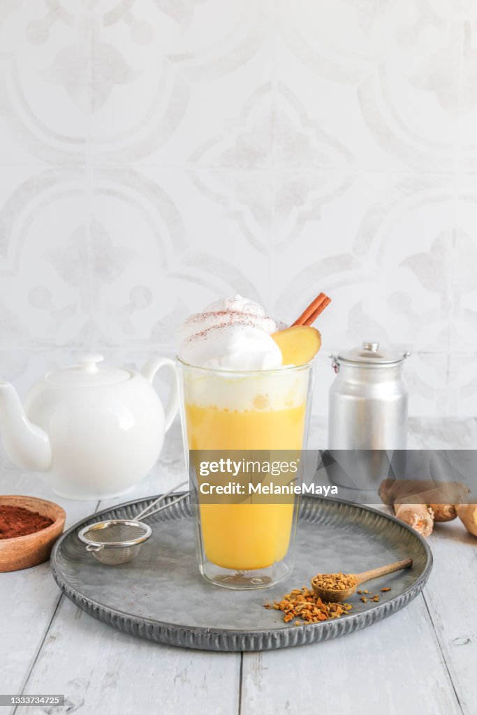 Golden Milk Chai Latte with tumeric and whipped cream