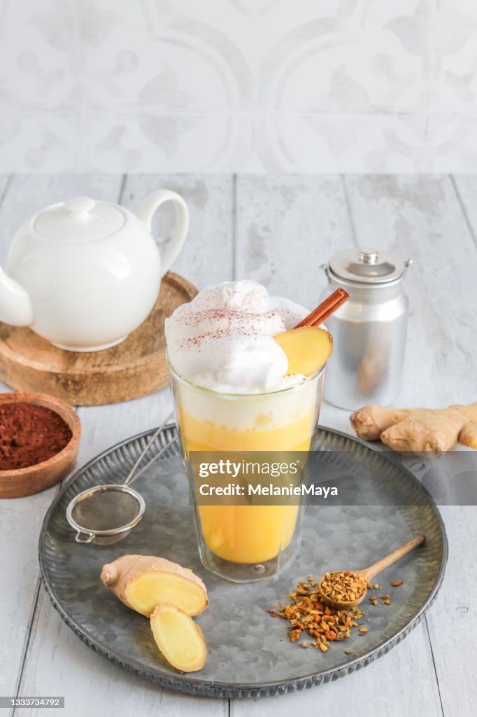 Golden Milk Chai Latte with tumeric and whipped cream