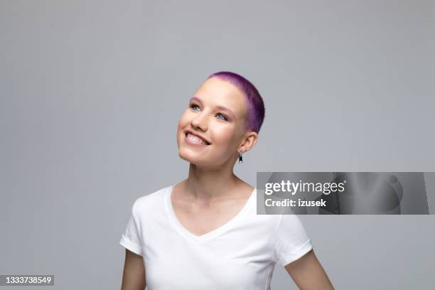 cheerful young woman with short purple hair - dyed hair stock pictures, royalty-free photos & images