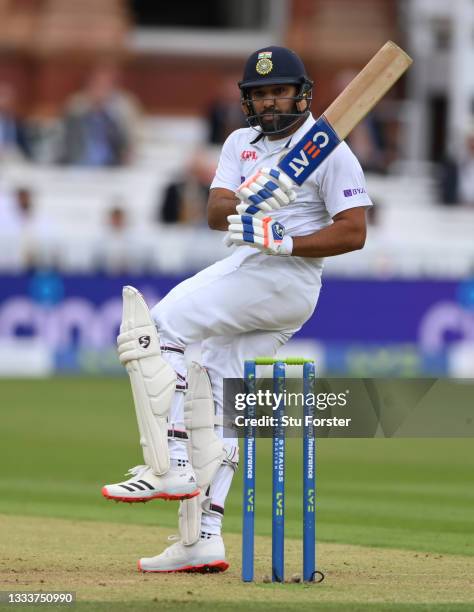 India batsman Rohit Sharma pulls a ball from Mark Wood to the boundary during day one of the Second Test Match between England and India at Lord's...