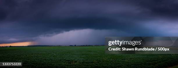 scenic view of field against storm clouds,lily lake,illinois,united states,usa - illinois landscape stock pictures, royalty-free photos & images