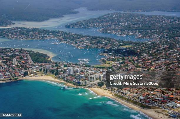 high angle view of city by sea,sydney,new south wales,australia - sydney ocean drone stockfoto's en -beelden