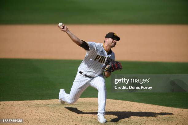Daniel Hudson of the San Diego Padres pitches during the eighth inning of a baseball game against the Miami Marlins at Petco Park on August 11, 2021...
