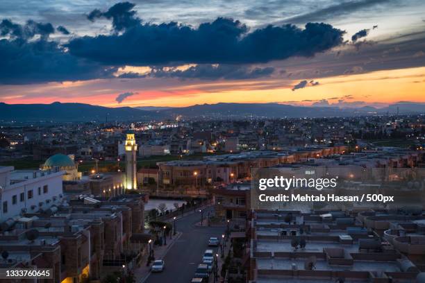 high angle view of illuminated buildings against sky during sunset,sulaymaniyah,iraq - sulaymaniyah stock pictures, royalty-free photos & images