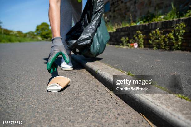 picking up litter - people picking up trash stock pictures, royalty-free photos & images