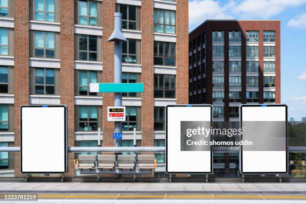blank digital screens at platform in train station - railway station platform stock pictures, royalty-free photos & images
