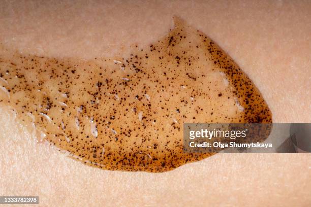 texture smear of coffee with honey brace on the skin close-up - body scrub stock pictures, royalty-free photos & images