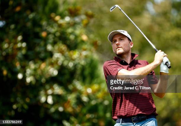 Russell Henley of the United States plays his shot from the 16th tee during the first round of the Wyndham Championship at Sedgefield Country Club on...