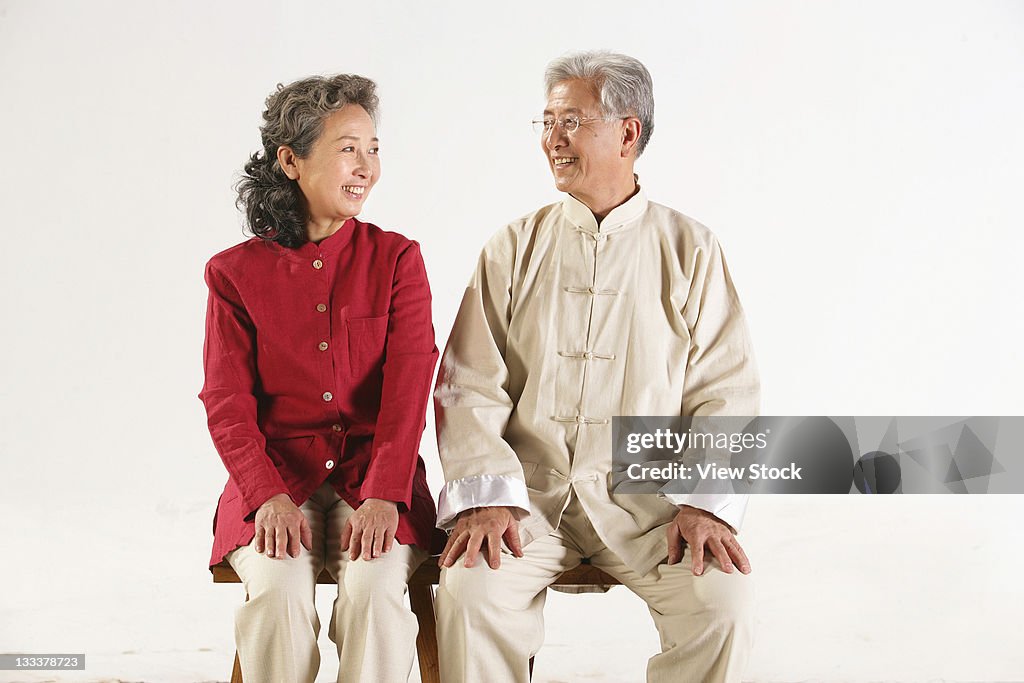 Old couple sitting together