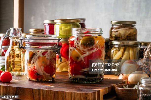 kitchen pantry. making pickled tomatoes - pickle jar imagens e fotografias de stock
