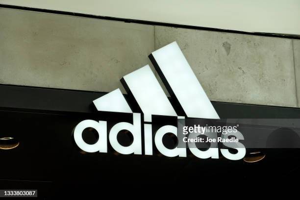 An Adidas sign at the entrance to the store on August 12, 2021 in Miami, Florida. Adidas is reported to have reached an agreement to sell its Reebok...
