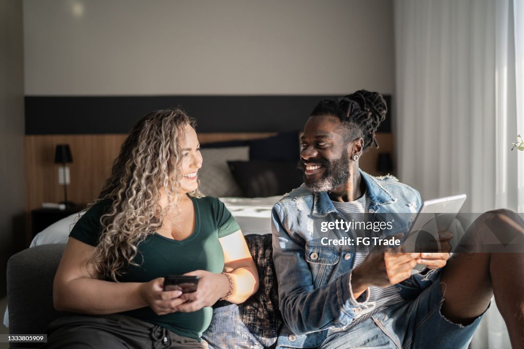 Couple together at home using portable information devices
