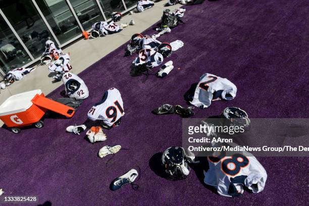 Denver Broncos gear lays on the ground outside of the weight room during a joint practice hosted by the Minnesota Vikings at TCO on Thursday, August...