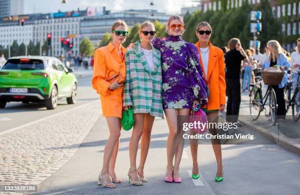 Annabel Rosendahl, Tine Andrea wearing green checkered oversized blazer Darja Barannik wearing orange dress, blazer, purple dress seen outside Baum...