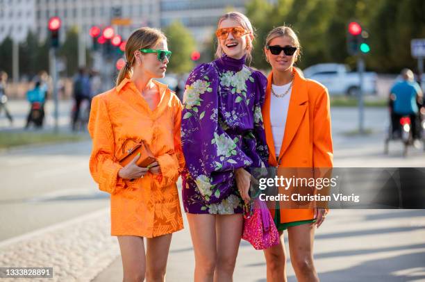 Annabel Rosendahl, Marianne Theordorsen, Darja Barannik wearing orange dress, blazer, purple dress seen outside Baum und Pferdgarten on August 11,...