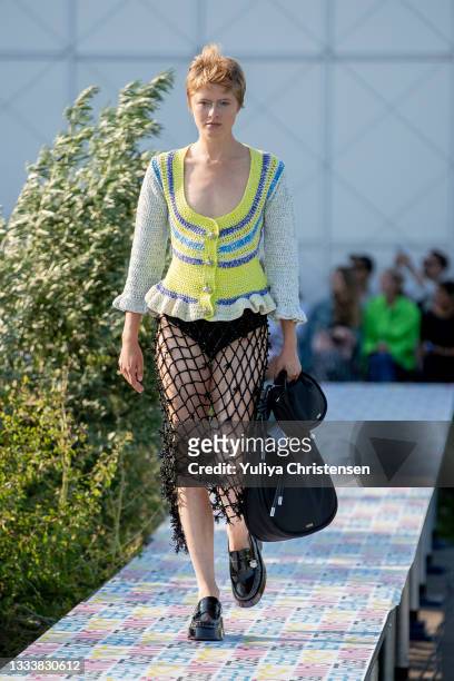 Model walks the runway at the GANNI show during the Copenhagen Fashion Week Spring/Summer 2022 on August 12, 2021 in Copenhagen, Denmark.