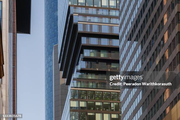 exterior architectural detail modern facade of high-rise office buildings. abstract urban metropolis background. - cladding stockfoto's en -beelden