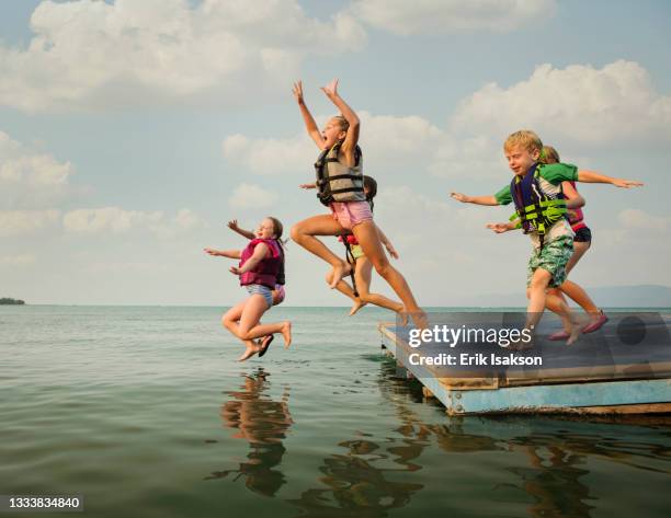 Getting Off A Raft 1,920 Young People Jumping Off Boat Stock Photos, High-Res Pictures ...