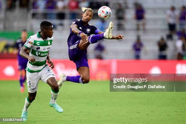 Nani of Orlando City SC looks to control the ball as Félix Torres of Santos Laguna defends during the first half of the Leagues Cup Quarterfinals at...