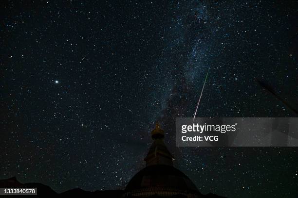 Perseid meteors streak over sky on August 13, 2021 in Golog Tibetan Autonomous Prefecture, Qinghai Province of China.