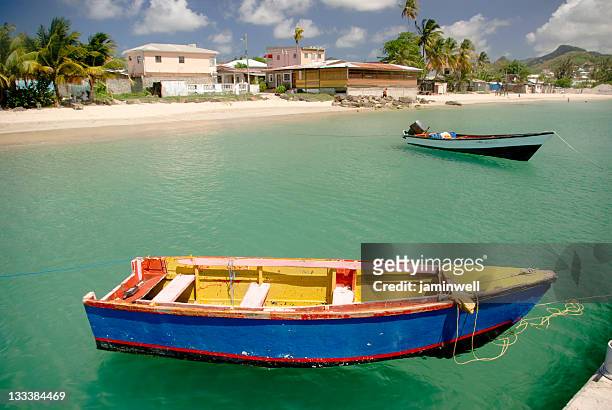 colorful fishing boats moored at gros islet st lucia - gros islet stock pictures, royalty-free photos & images