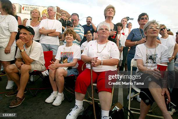 Fans view a Memphis band perform during a party outside Sun Studio during Elvis Week on August 12, 2002 in Memphis, Tennessee. 75,000 fans are...