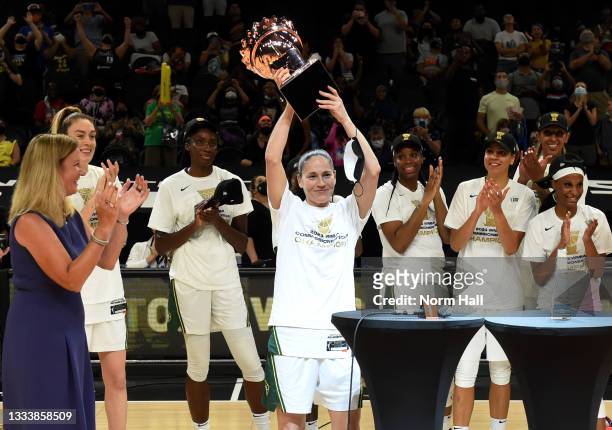 Commissioner Cathy Engelbert presents the championship trophy to Sue Bird of the Seattle Storm after a 79-59 win against the Connecticut Sun during...