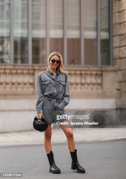 Scarlett Gartmann wearing Copenhagen Studios black boots, Kapten & Son shades, Bottega Veneta mini Jodie bag and Isabel Marant Etoile denim grey two...