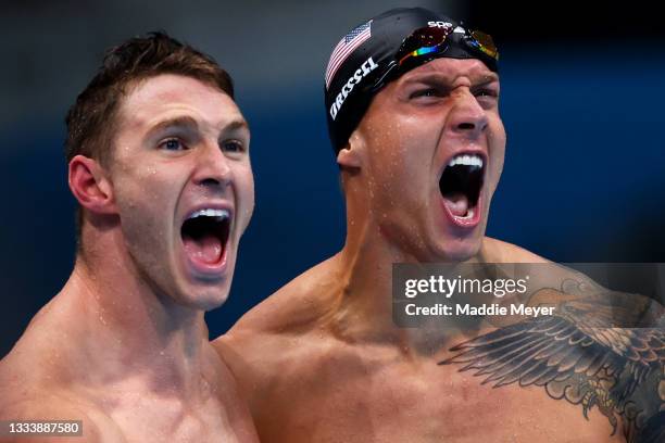 Ryan Murphy and Caeleb Dressel of Team United States react after winning the gold medal and breaking the world record in the Men's 4 x 100m Medley...