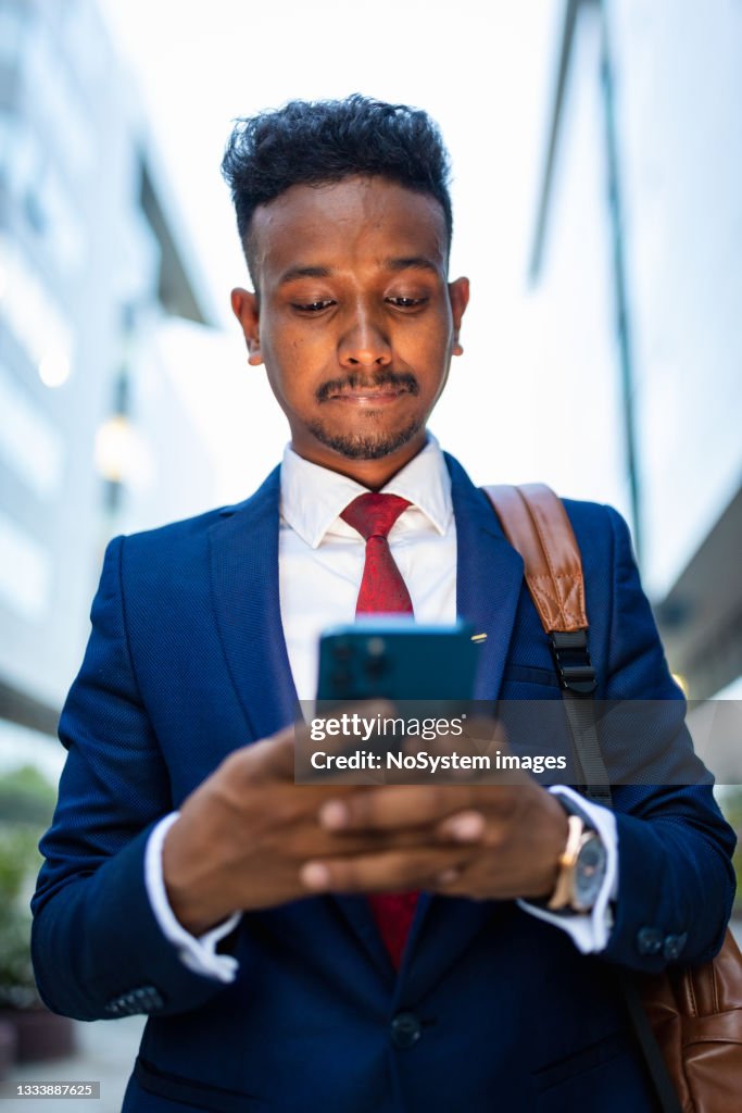 Businessman Rushing Businessman Rushing To The Office Using Phone High-Res Stock Photo ...
