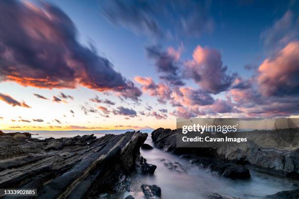 view of the sunset sky over the sea from miura peninsula, japan - cinematic stock pictures, royalty-free photos & images