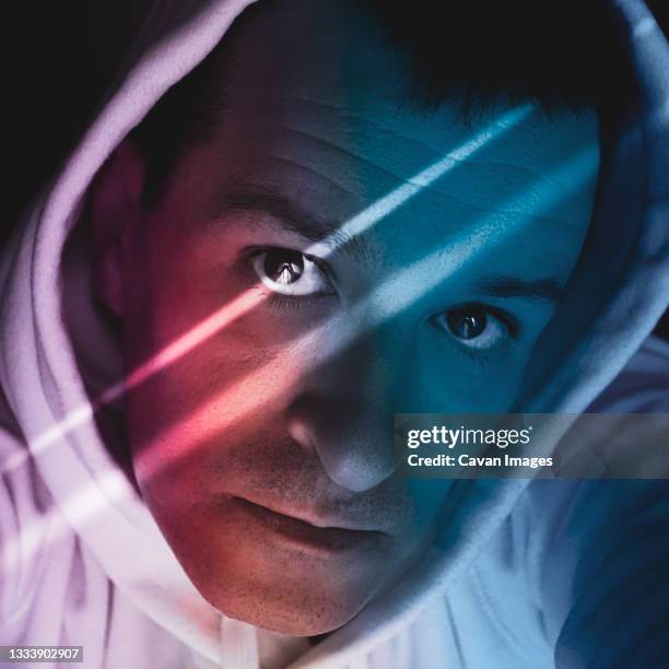 man portrait with blue and red light in the shadows - flash eyelashes stock pictures, royalty-free photos & images