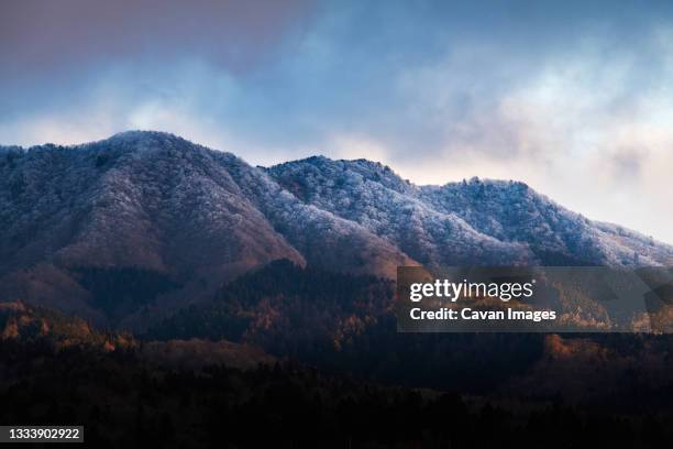 view of snow-capped mountains from lake yamanaka, yamanashi prefecture, japan - cinematic stock pictures, royalty-free photos & images