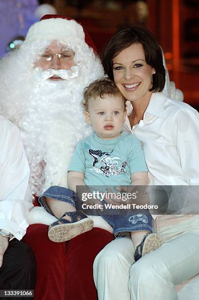 Natarsha Belling poses with Santa Claus at Bondi Junction Westfield on November 16, 2007 in Sydney, Australia.