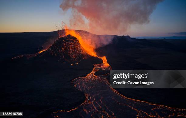 volcano eruption landscape in night time - iceland lava stock pictures, royalty-free photos & images