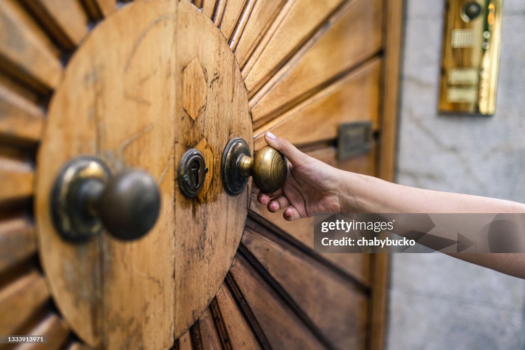 Hand and old door