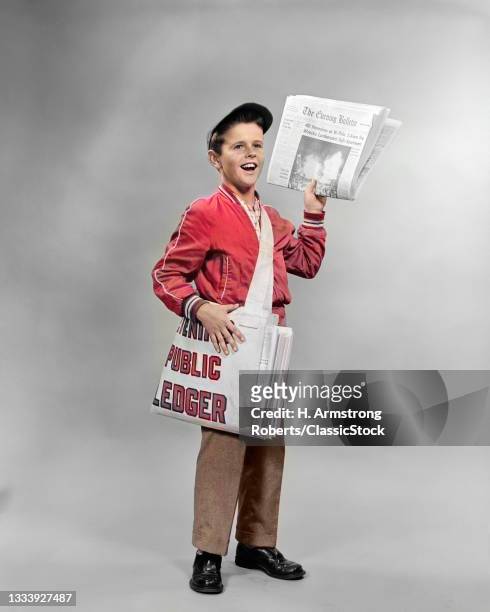1950s Shouting Newsboy Standing Selling Newspapers .