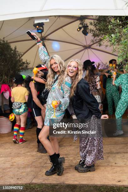 Madelaine Griffiths wears In your dreams make up, Asos top and skirt, Topshop bag and Nasty Gal boots with Roisin Cusack wearing Nasty Gal boots,...