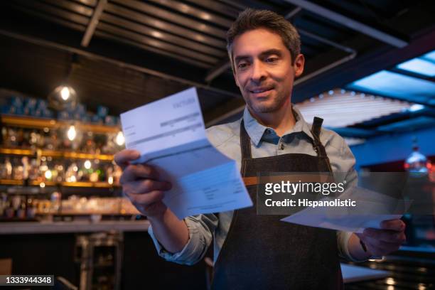 business manager at a restaurant getting bills in the mail - opening event stock pictures, royalty-free photos & images