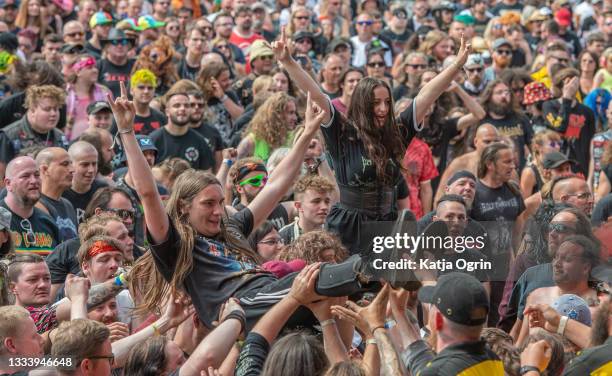 Heavy metal fans crowdsurfing at Bloodstock Festival 2021 at Catton Hall on August 13, 2021 in Burton Upon Trent, England.