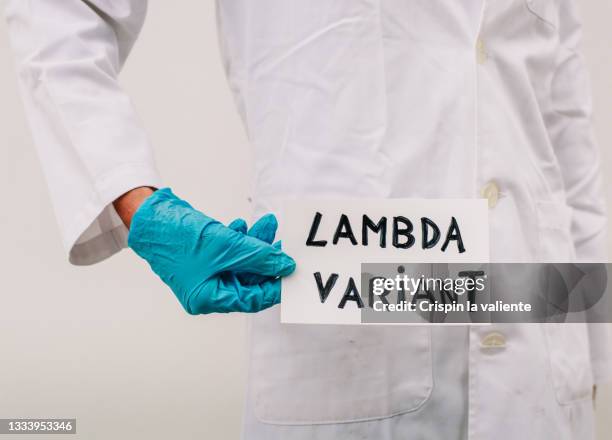 lambda variant covid, scientist, surgical glove - lambda phage stock pictures, royalty-free photos & images