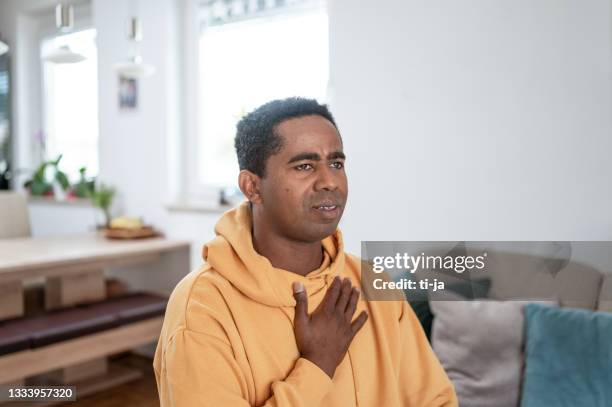 adult man with pain in chest - hands on chest stock pictures, royalty-free photos & images