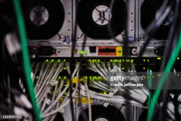 shot of internet equipment and equipment in a server room - cable modems stock pictures, royalty-free photos & images