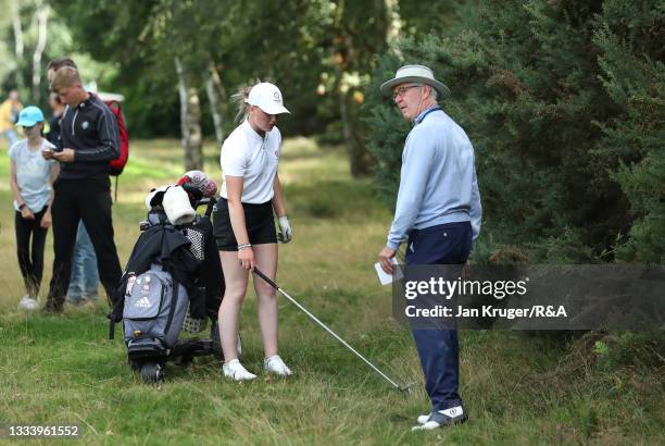 Maggie Whitehead of Close House receives a ruling from a R&A official during her semi-final match on day four of the R&A Girls Amateur Championship...