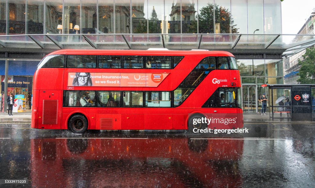 Double Decker London bus in heavy rain