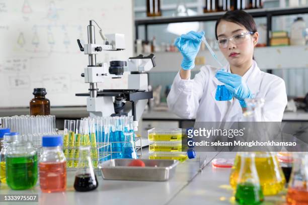 medical technologist is working with blood tube in the laboratory. - doctor lab coat stockfoto's en -beelden