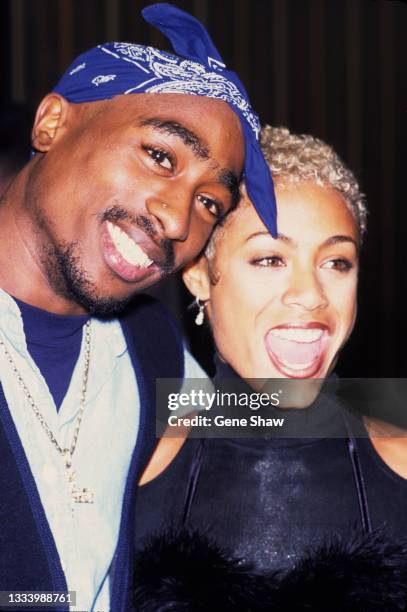View of American rapper and actor Tupac Shakur and actress Jada Pinkett Smith as they pose together at a movie premiere, New York, New York, 1996.