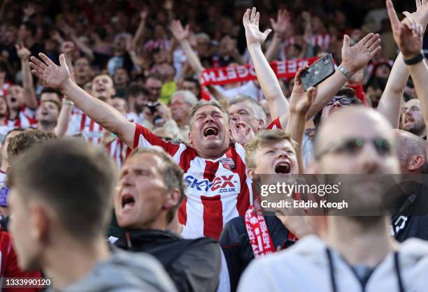 Brentford fan reacts during the Premier League match between Brentford and Arsenal at Brentford Community Stadium on August 13, 2021 in Brentford,...